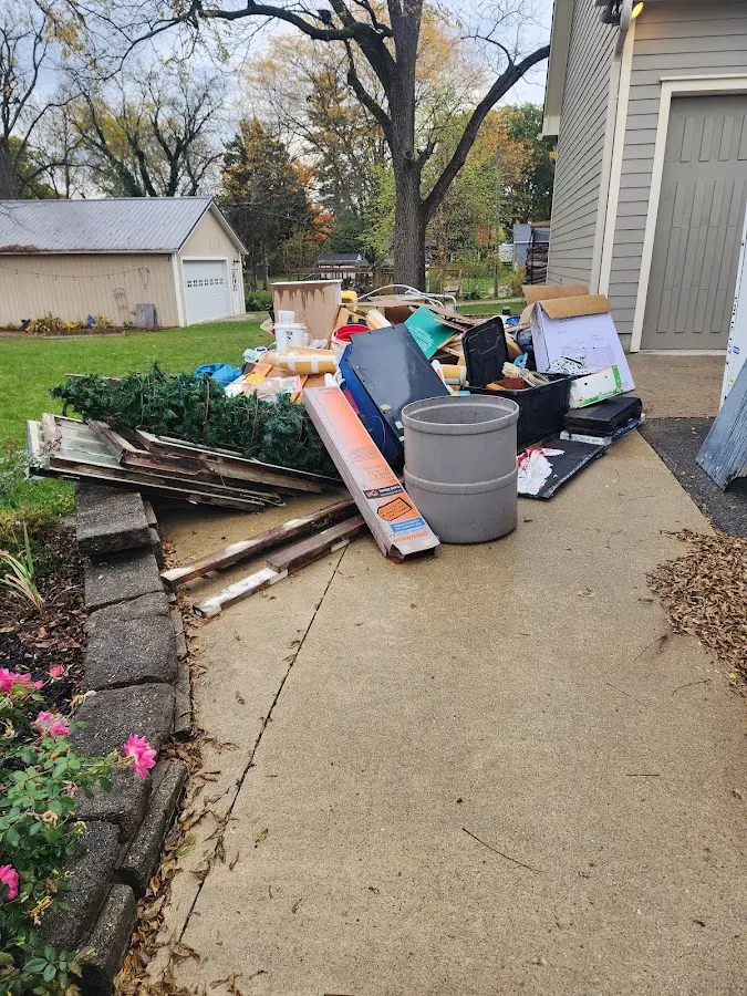 Dumpster being loaded with debris for Demolition Dumpster Rental in Warwick